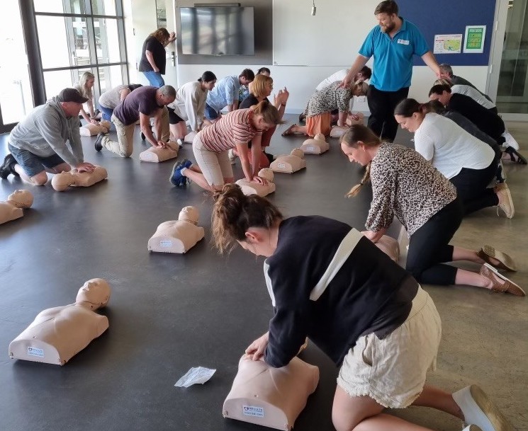 Hands-on first aid practice with a CPR mannequin